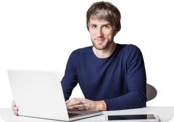 Young professional works on laptop, engaging directly, minimalist white setting.