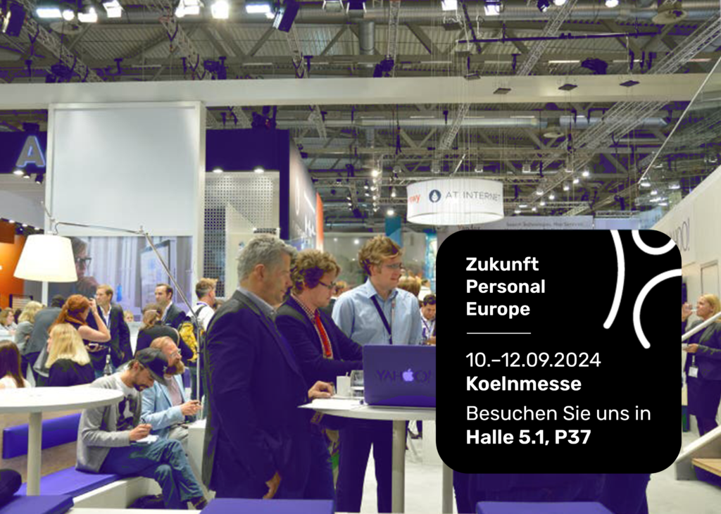 Attendees engage at Yahoo! booth at Zukunft Personal Europe trade show.